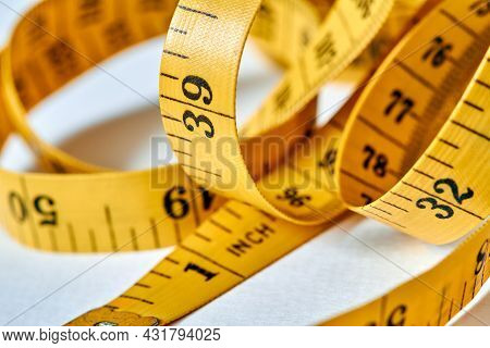 Yellow Color Centimeter With Black Figures For Measurement Of Length And Width On A White Background