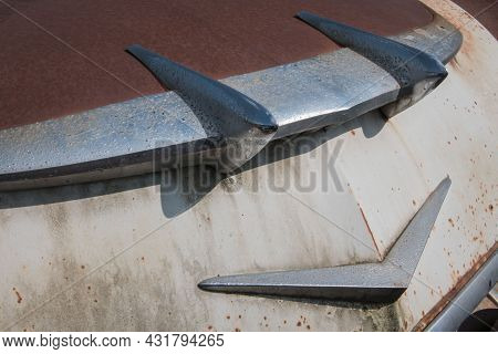 Partial View Of The Front Of An Old Rusty Car With Lots Of Chrome