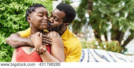 Young afircan american couple smiling happy and hugging at the city.