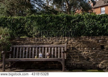 Ravana And Giantess Sitting On The Wooden Chair At The Park. Traveller Doll.