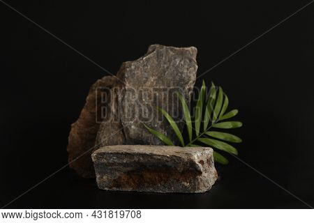 Rock Podium On The Black Background With Tropical Leaves. Stone Podest For Product, Cosmetic Present