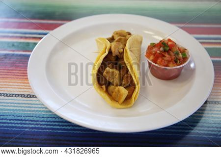 Soft tacos with spicy chicken. authentic Mexican tacos with chicken and salsa. 