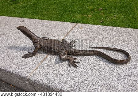 Amsterdam, Netherlands - August 15, 2021: Closeup Of 1 Small Statue Of Lizard Or Comodo Dragon On Be