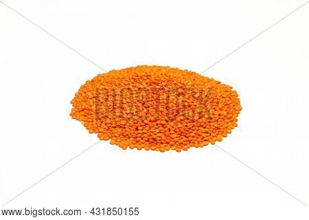 Raw Red Lentils Seeds Heap On White Background. Food Ingredient. Top View.