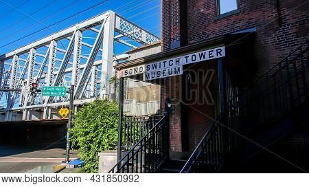 NORWALK, CT, USA - SEPTEMBER 2, 2021: SONO switch tower museum on Washington Street  in downtown with railroad bridge