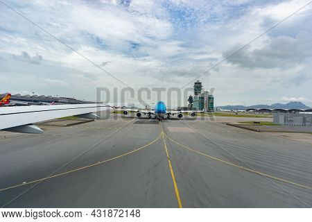 Chek Lap Kok Hong Kong - August 3 2017; Planes And Runway Markings Leading From Plane On Airport Run