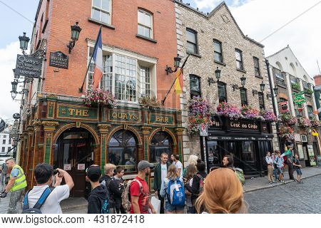 Dublin, Ireland - August 10 2017; Young Tourists In Street Outside Well Known Irish The Quays Bar In