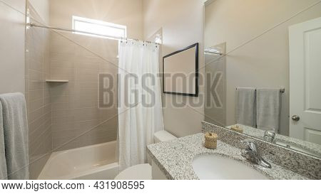 Pano Bathroom Interior With Vanity And Tub With Light Brown Rectangular Wall Tiles And Window