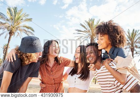 Group Of Young People Laughing And Having Fun Outside A Beach Town. Summer Concept, Multiethnic, Int