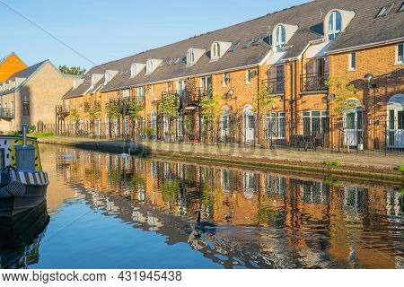 Canal-side Apartments Reflected In Calm Water In Morning Light In Bow Wharf Area Hertford Union Cana