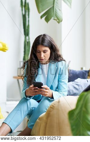 Vertical Photo Of A Beautiful Latina Businesswoman Drinking Coffee In A Nice Modern Apartment Using 