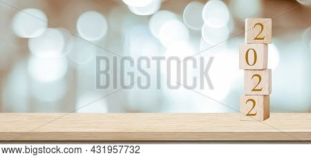 Happy New Year 2022 On Wood Cube Block And Blur Abstract Bokeh Light Background With Copy Space For 
