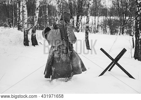 Re-enactor Dressed As World War Ii Russian Soviet Red Army Soldier Marching Through Snowy Winter For