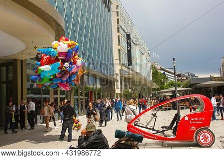 Frankfurt, Germany - June 15, 2016: The Dealer Of Colorful Balloons Walking Along The Zeil In Midday