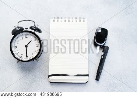 Diabetes Diet Planning Concept, Set Of Watch, Notepad And Glukometr