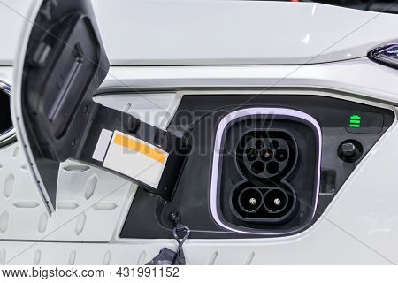 Charge Port On An Electric Car, Ev Charging Port On Electric Car.  Electronic Car Charging Devise Pu