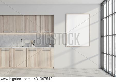 Empty Canvas On The White Wall Of The Light Wood Kitchen With A Marble Splashback And Metallic Handl