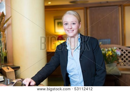 Beautiful blond hotel receptionist