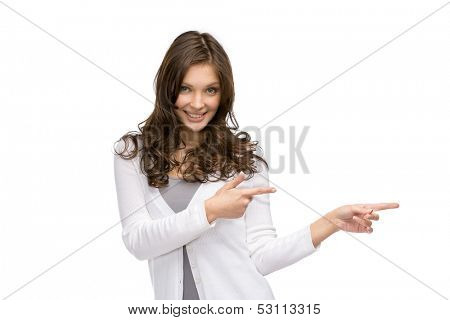 Half-length portrait of young girl pointing hand gesture, isolated on white