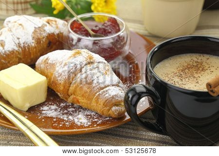 Breakfast with croissants and coffee