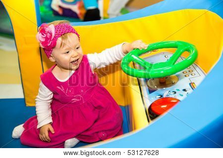 Happy Baby Girl  Keep On Board Ship On Playground  The Concept Of Childhood And Holiday