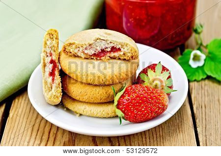 Biscuits With Strawberries And Jam On The Board