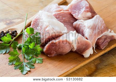 Fresh Raw Meat On Wooden Background With Pepper In Spoon