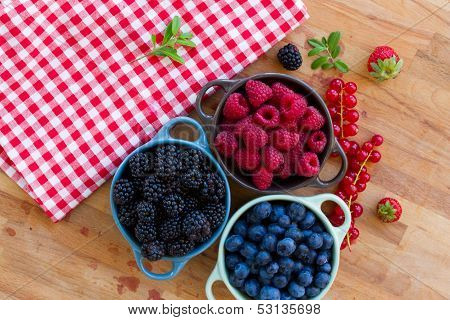 Three bowls of fresh berries