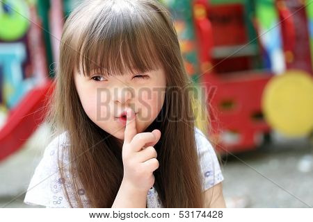 Portrait Of Beautiful Young Girl On The Playground.