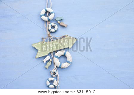 Blue Background With A Signpost To The Harbour