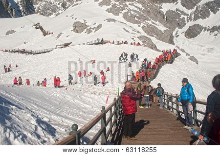 Wooden Stair And Traveler On Jade Dragon Snow Mountain,lijiang,yunnan,southwestern China.