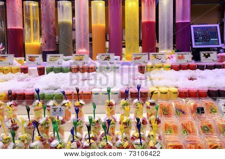 BARCELONA - AUGUST 8: A lot of fruit mousses on a market stall in the Mercat de Sant Josep de la Boqueria in one of the oldest markets in Europe on 8 August 2014 in Barcelona, Spain.