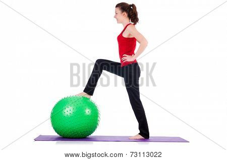 Young woman exercising with swiss ball