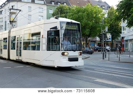DUSSELDORF, GERMANY - JUNE 29, 2013: Modern tram on the Helmholtz street. The tramway network is operated by Rheinbahn AG and has eleven tram lines ran over 78.0 kilometres of route