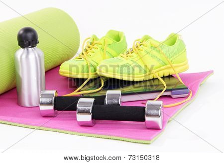 Sport requisites on a carpet isolated on white