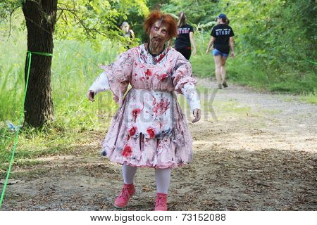 MUSKOGEE, OK - Sept. 13: A bloody female zombie waits for runners during the Castle Zombie Run at the Castle of Muskogee in Muskogee, OK on September 13, 2014. 