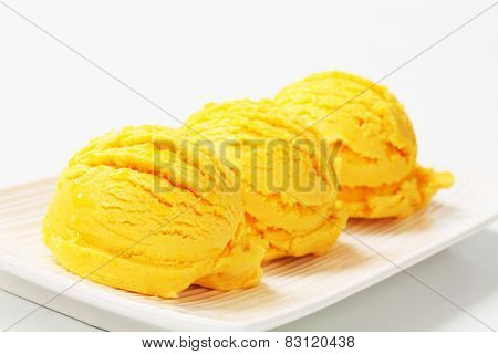 Scoops of mango vanilla ice cream