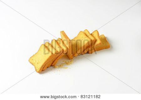 crispy rusks on white background