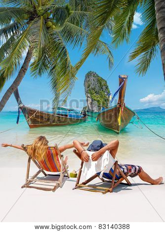 Couple of tourists on the beach in Thailand