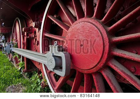 Red wheels of big old steam locomotive from Orient Express