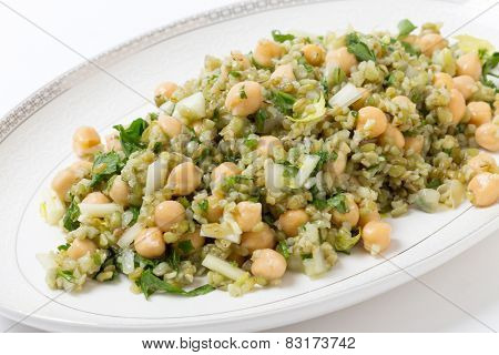 Freekeh salad with chickpeas, onion, parsley, celery, and a lemon juice and olive oil dressing