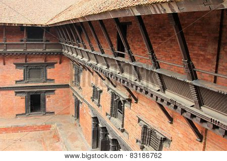 PATAN, NEPAL - APRIL 2014 : View of the external corridor on the balcony at Patan Museum in Patan, Nepal on 13 April 2014. Patan Museum is an old royal palaces of the Kathmandu Valley.