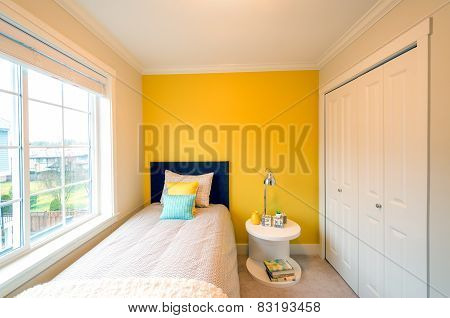 Modern yellow bedroom interior.