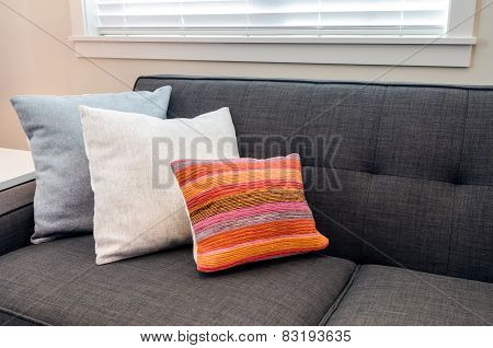 Designer pillows on a sofa