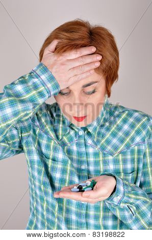 Woman with handful of drugs