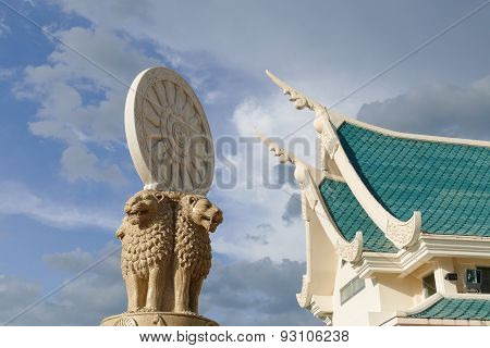 Lion Statue And Wheel Of The Law In Front Of Buddhist Church