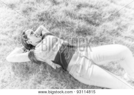 Beautiful Teenager Lying On The Grass