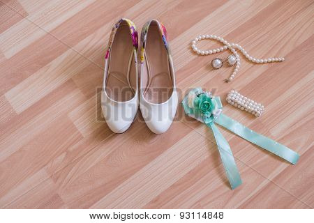 wedding shoes bracelet and earrings, a necklace