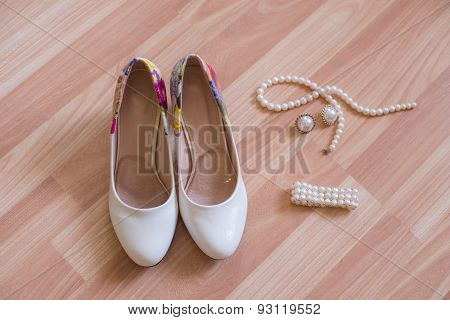 wedding shoes bracelet and earrings, a necklace