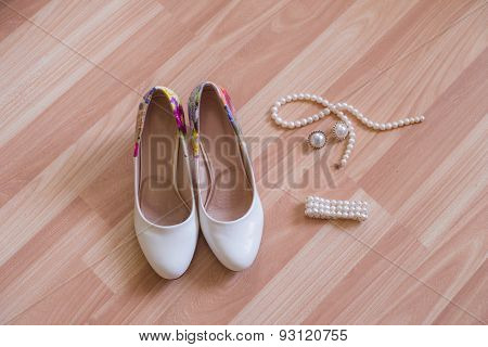 wedding shoes bracelet and earrings, a necklace